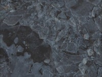 a close up image of a black granite surface