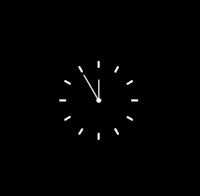 a white clock on a black background